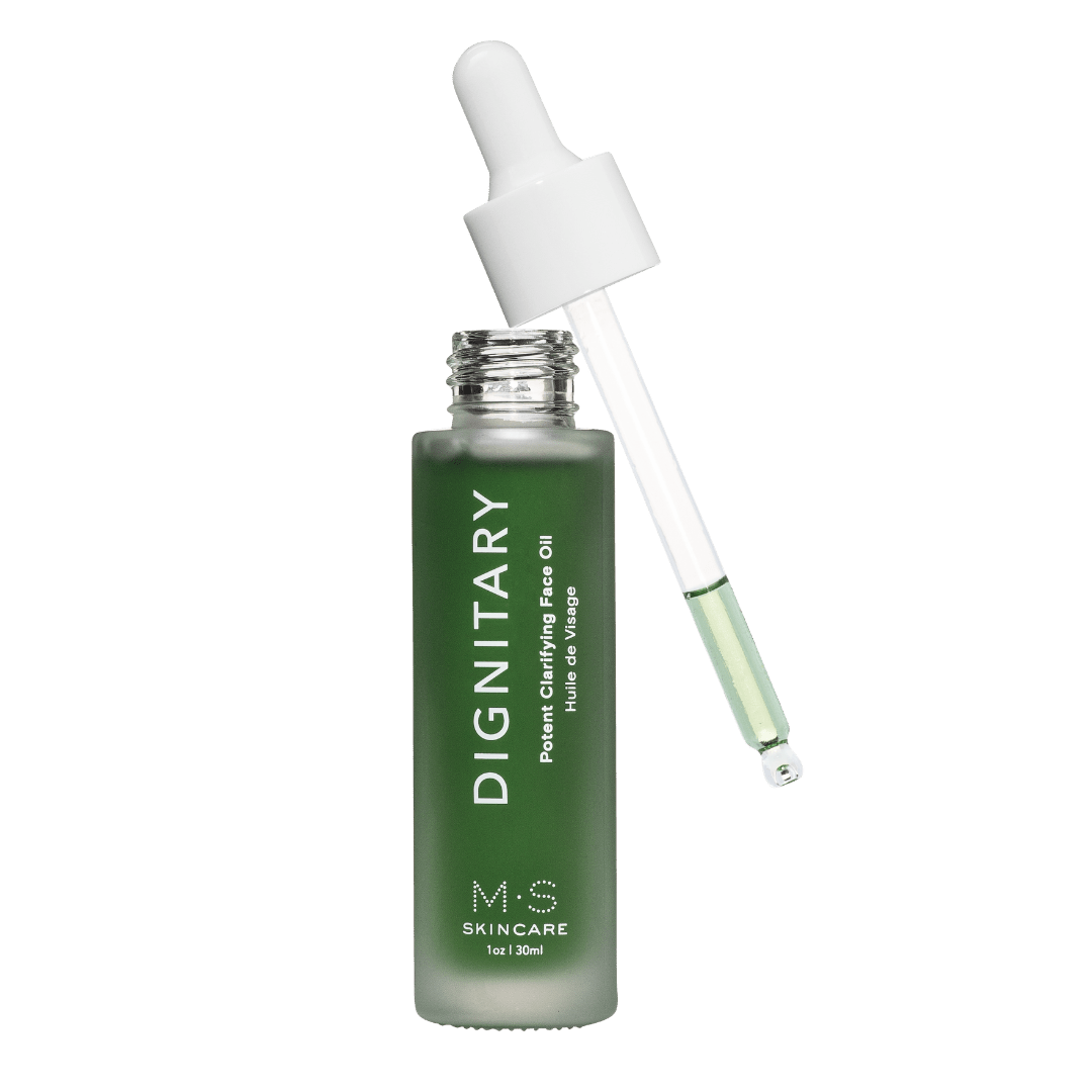 M.S Skincare DIGNITARY Clarifying Face Oil green luxury face oil in a frosted white bottle with white printing and dropper.