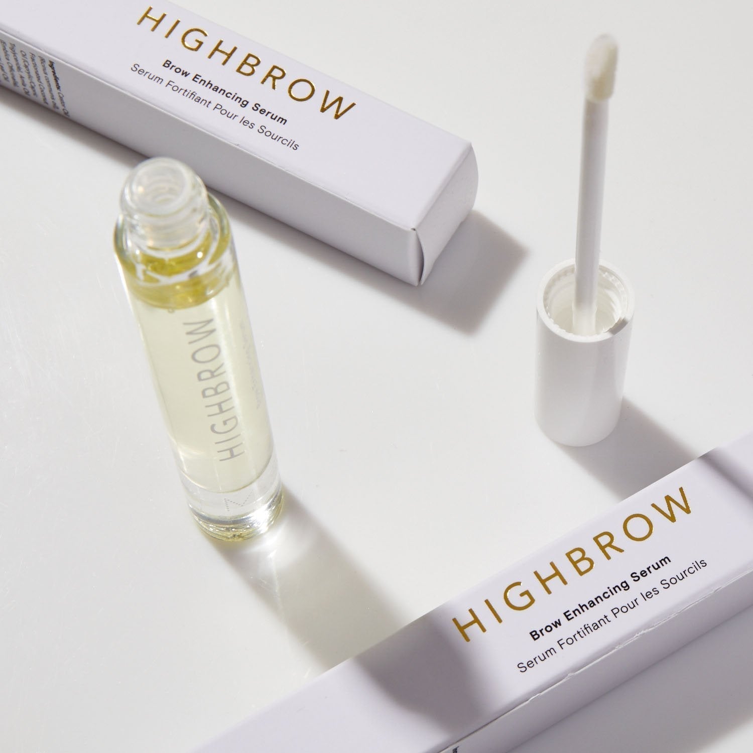 M.S Skincare HIGHBROW Brow Enhancing Serum in a glass container with white wand and cap.