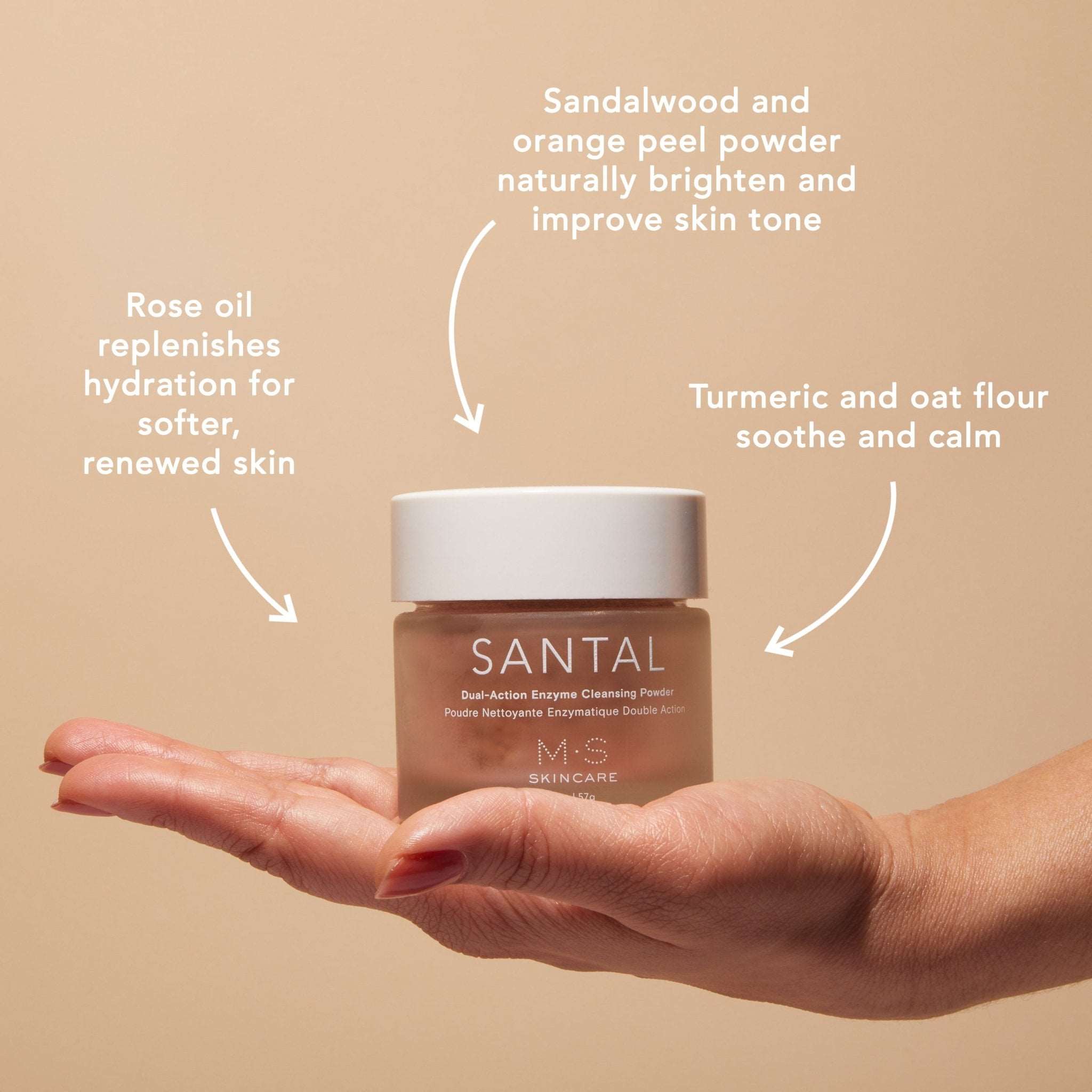 M.S Skincare SANTAL Dual-Action Enzyme Cleansing Powder- pink ayurvedic powder in a thick glass jar and white cap on a hand.