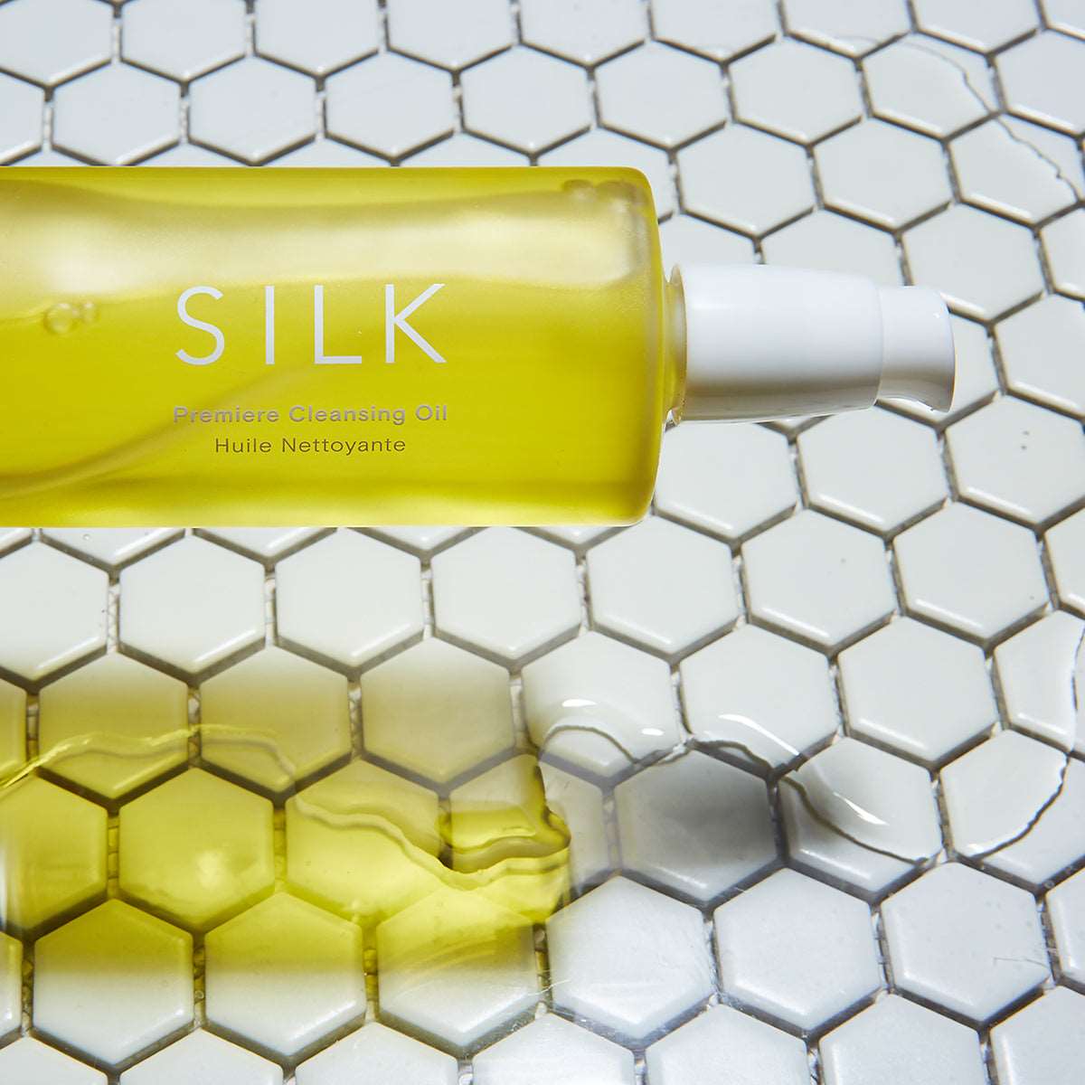 M.S Skincare SILK Premier Cleansing Oil-golden Ayurvedic oil in a frosted bottle with white printing and pump sideways.